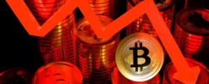 moeda de bitcoin na frente de um gráfico vermelho